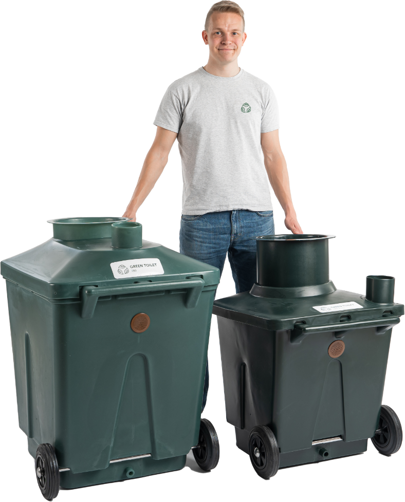 A man standing behind two Green Toilet composting containers: the large 330 and the smaller 120 Family.