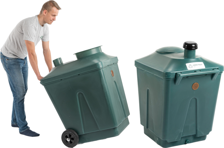 A man wheeling a full Green Toilet container out next to an empty one.