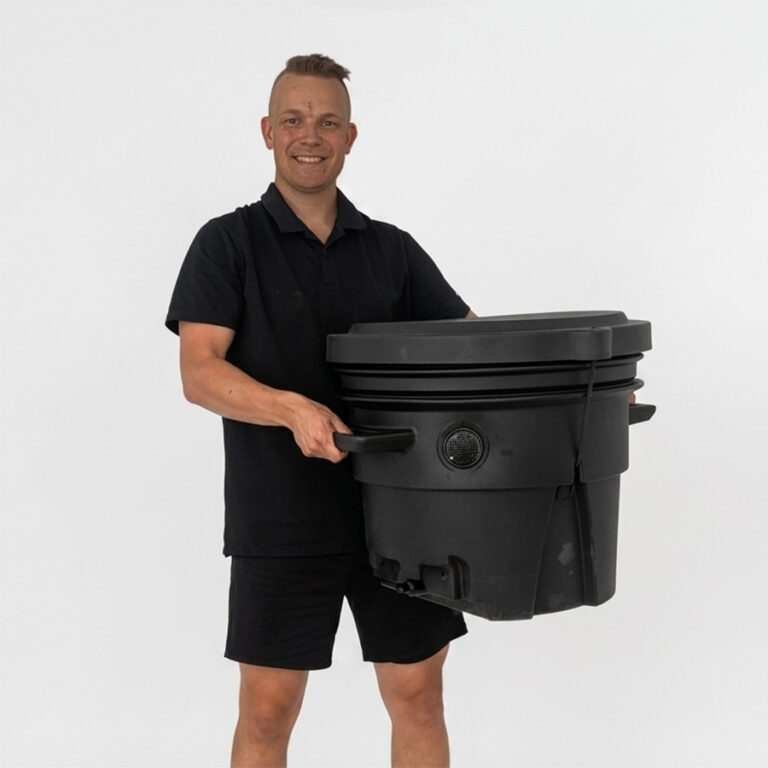 A man carrying the Compact Lux container by its side handles.